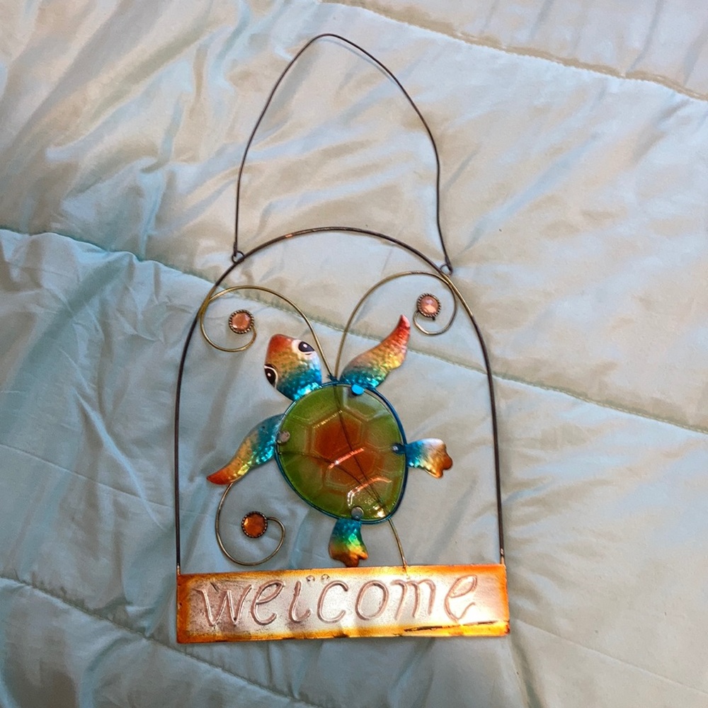 Welcome sign with rainbow turtle